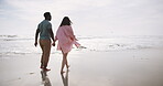 Beach, walking and couple holding hands on romantic date for love, support and travel or holiday together. Man, woman and vacation on seashore barefoot for adventure, explore and summer sunset