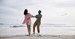 Couple, holding hands and spinning with love on beach, playful and travel adventure with romantic date on holiday in Australia. Man, woman and together for bonding with ocean waves and commitment.