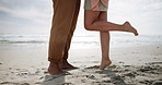 Couple, legs and feet on beach together, romance and love for bonding relationship in vacation on seaside. Wellness, commitment and summer holiday and ocean, standing and relax on sand with partner