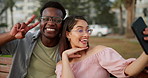 Happy, interracial couple and nature with selfie at park for photography, memory or picture together at park. Man and woman with smile, peace sign or emoji on bench for outdoor moment or capture