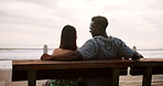 Couple, back and bench date or outside together for bonding, relationship and commitment or affection. Romance, embrace and summer vacation or happy, ocean and weekend break for people in love