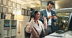 Happy, business people and night with headphones for music, audio or sound track at office. Young businessman or woman working late with smile for fun podcast, playlist or tunes together at workplace