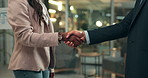 Business people, night and agreement with handshake for deal, partnership or hiring at office. Closeup of businessman and woman shaking hands for meeting, greeting or teamwork together at workplace