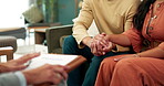 Meeting, therapist and couple holding hands on sofa for pregnancy advice, communication or emotional support in office. Marriage, help and people for discussion, information or parenting guidance