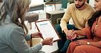 Therapist, clipboard and couple holding hands on sofa for pregnancy advice, communication or emotional support in office. Meeting, help and people for discussion, information or parenting guidance