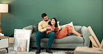 Happy couple, tablet and home on sofa with discussion, online ideas for decorating in apartment. Man, woman and together on couch with mobile tech, communication or planning for design in living room