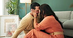 Happy, couple and love with embrace on floor new house for bonding, care or conversation of future dream. Smile, woman and man in living room with trust, support and loyalty of real estate commitment