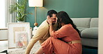 Couple, happy and love with embrace on floor new house for bonding, care or conversation of future dream. Smile, woman and man in living room with trust, support and loyalty of real estate commitment