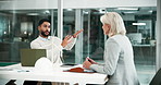 Feedback, talking and planning by laptop in office, support and meeting for wind turbine advice. Mentor, leader and employee with question, clean energy and review for strategy for project coaching