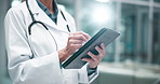 Tablet, medical and hands of doctor in hospital for research on treatment, diagnosis or cure. Online, career and closeup of female healthcare worker with digital technology for telehealth in clinic.