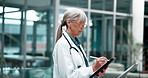 Woman, pen and mature doctor with tablet in hospital for research on treatment, diagnosis or cure. Online, career and female medical worker with digital technology for telehealth on website in clinic