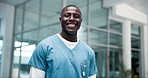 Black man, healthcare and doctor in hospital for portrait, success and medical care in lobby. Male nurse, medicine and happy in workplace for support, career and expertise for pharmaceutical company