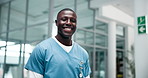 Black man, healthcare and smile in hospital for portrait, success and medical care in lobby. Male nurse, doctor and happy in workplace for support, career and expertise for pharmaceutical company