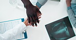 Medical, support and doctors with hands together in hospital for meeting, report and collaboration. Top view, xray and healthcare documents with gesture for radiology results, motivation and teamwork