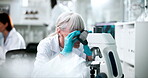 Medicine, microscope and science with woman in laboratory for breakthrough, discovery or experiment. Innovation, medical and research with mature scientist at work on cure or vaccine for biology