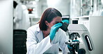 Microscope, research and science with woman in laboratory for breakthrough, discovery or experiment. Biology, innovation and medicine with mature scientist at work on cure, treatment or vaccine