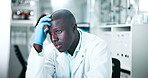 Black man, scientist and stress in lab on computer, medical research and planning investigation. Male person, exhausted and employee for biotechnology, tired and deadline for experiment results