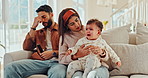 Crying, home and parents with baby for comfort, empathy and care for emotional child on sofa. Family, love and mom, dad and newborn for embrace, affection and support for bonding or relationship