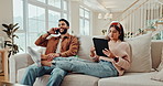 Couple, phone call and tablet in home with tech and conversation with social media and web scroll. Mobile, technology and communication on a living room couch with relax people and internet app