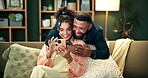 Couple, happy and couch for hug with smartphone, smile and love in home for relationship bonding together. Lounge, woman browsing and man laugh for meme on social media, affection and reading post
