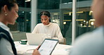 Tablet, meeting and team in office for feedback, planning and discussion at table at night. Marketing strategy, people and technology at desk for information, idea and communication in workplace