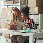 Startup, inventory and women with boxes, tablet and teamwork with ...
