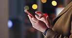 Person, hands and night with phone for communication, social media or research at office. Closeup of business employee typing on mobile smartphone for online browsing, scrolling or app at workplace