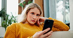 Woman, relax and typing with phone on sofa for online browsing, social media or news at home. Female person scrolling on mobile smartphone for choice, selection or research in living room at house