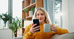 Happy woman, phone and relax with coffee on sofa for morning, social media or online browsing at home. Female person reading news with cup of tea, beverage or drink on mobile smartphone for chatting