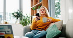 Home, coffee and woman on couch, smartphone and internet with cappuccino, social media and texting. Person, apartment and girl with morning tea, cellphone and check online news with app and espresso