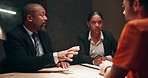 Lawyer, talking and criminal client in interrogation room for investigation, information or arrest. Advocate, diversity and people with suspect for justice, interview or planning alibi for case 