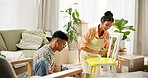 Couple, painting chair and move in to new home for renovations, relocation and furniture building. Relationship, man and woman together with tools for bonding, support and partnership for teamwork