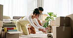 Couple, happy and carpet in new home for moving, house and lounge aesthetic on floor with teamwork. People, smile and rug or furniture for living room, renovation and interior design with cooperation