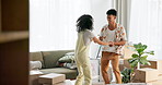 Dancing, happy and couple in living room with boxes for moving in to new home with celebration. Smile, love and young man and woman with fun to music, playlist or radio for bonding at apartment.