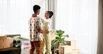 Happy, couple and dance in new home with love for investment, mortgage and achievement of goals. Man, woman and romance with cardboard box in house for partnership, moving and growth in marriage