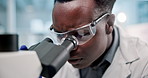 Science, black man and microscope or analysis in laboratory for results on medical research and experiment. Innovation, professional and expert with goggles for scientist development and study review