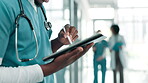 Nurse, hands and working on tablet in hospital with healthcare or medical records, history or schedule. Doctor or person with pen for writing on digital, software or cloud storage for clinic services