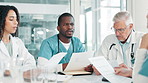 Paperwork, medical and team discussion in meeting for healthcare report, brainstorming or mentor training nurses. Group, doctor and people planning with documents for collaboration in hospital clinic