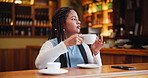 Happy, woman and student on study break at cafe drinking coffee for rest and relax before class. Calm, female person and caffeine beverage in restaurant with smartphone for connection and time