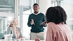 Black man, tablet and coaching with presentation in meeting for corporate growth, finance or revenue at office. Young African, male person or employee talking to group on company profit or investment