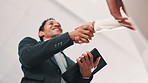 Shaking hands, meeting and business people in office with agreement, deal or company merger. Welcome, greet and hr with candidate for onboarding or recruitment handshake in workplace from bottom view