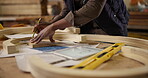 Carpenter, hands and pencil with measurement for construction, furniture or project. Closeup of person marking wood with tools in a creative carpentry workshop for manufacturing, art and craft