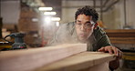 Carpenter, sanding and sawdust with wood beam for construction, furniture or project. Person, designer and dust blow with tools in a creative carpentry workshop for manufacturing, art and craft