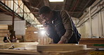 Carpenter, phone call and black man in workshop with tablet for manufacturing, wood furniture and business. Carpentry, lumber factory and person talking on smartphone with client for timber order