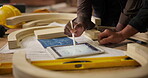 Carpenter, hands and tablet with digital plans for construction, furniture or project. Closeup of people, discussing wood with tools in a creative carpentry workshop for manufacturing, art and craft