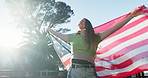 American flag, independence day and happy woman outdoor for celebration, freedom and national holiday of country. Nature, democracy or patriotism for home land with devotion, pride or loyalty of girl