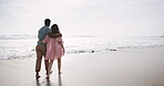 Beach, walk and interracial couple for romance, honeymoon and travel for fun, happy and hugging. Woman, embrace and sea on date to show partner adventure, happiness or bonding for joy on holiday