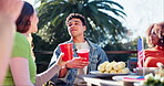 Discussion, independence day and people with drinks, party and celebration of USA culture. American, pride and group of friends relax outdoor on holiday event in summer with freedom and beer together