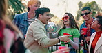 Friends, dance people with alcohol at party for celebration, music festival and spring break outdoors. Happy, crowd and men and women with drinks for concert, social gathering and event on holiday