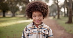 Black child, happy and park with fashion for holiday, weekend or outdoor joy in nature. Portrait of little boy, African kid or young toddler with smile or afro in tshirt for cool or stylish clothing